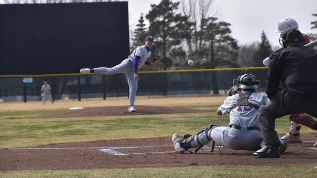 Louis Magers follows through on a strike in DII baseball. 